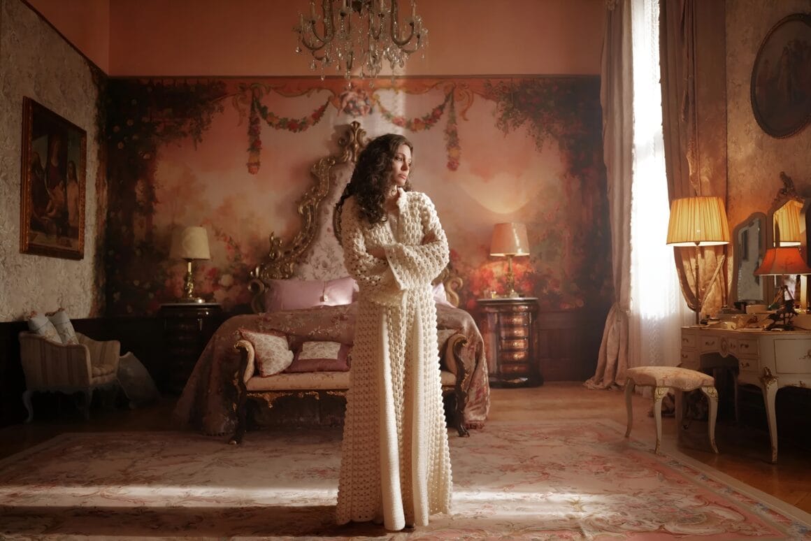 Angelina Jolie Wearing Cream Robe in Maria Movie