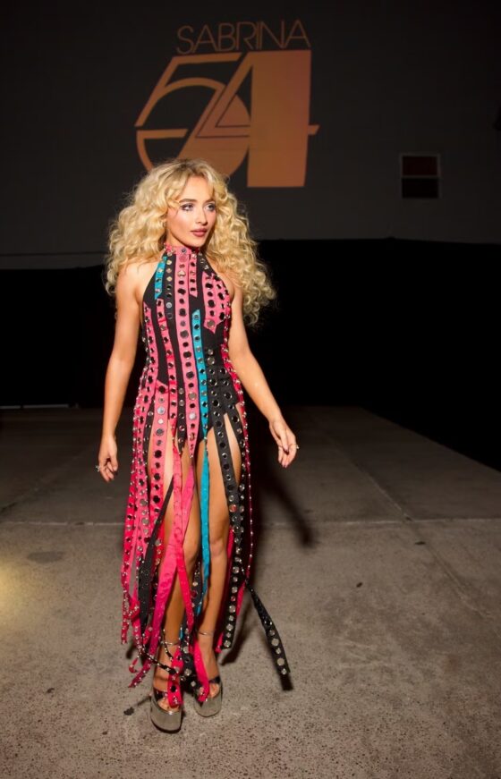 Sabrina Carpenter wearing an archival 1975 costume by Bob Mackie in pink and blue fringe